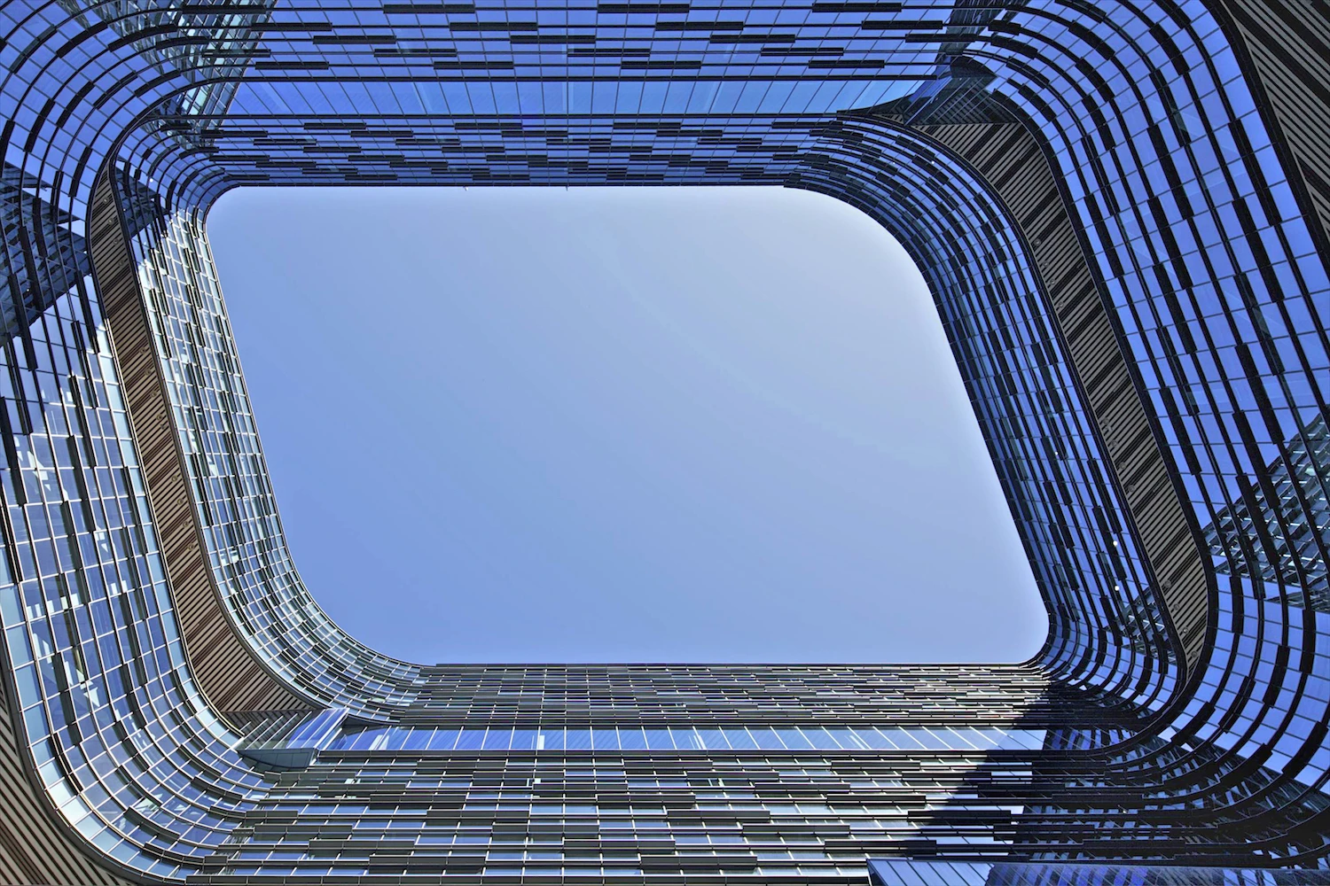 America's David Crawford's entry contrasts the blue of the sky with the Samsung Electronics HQ building in San Jose, California, by NBBJ. The image was entered into the Exterior category