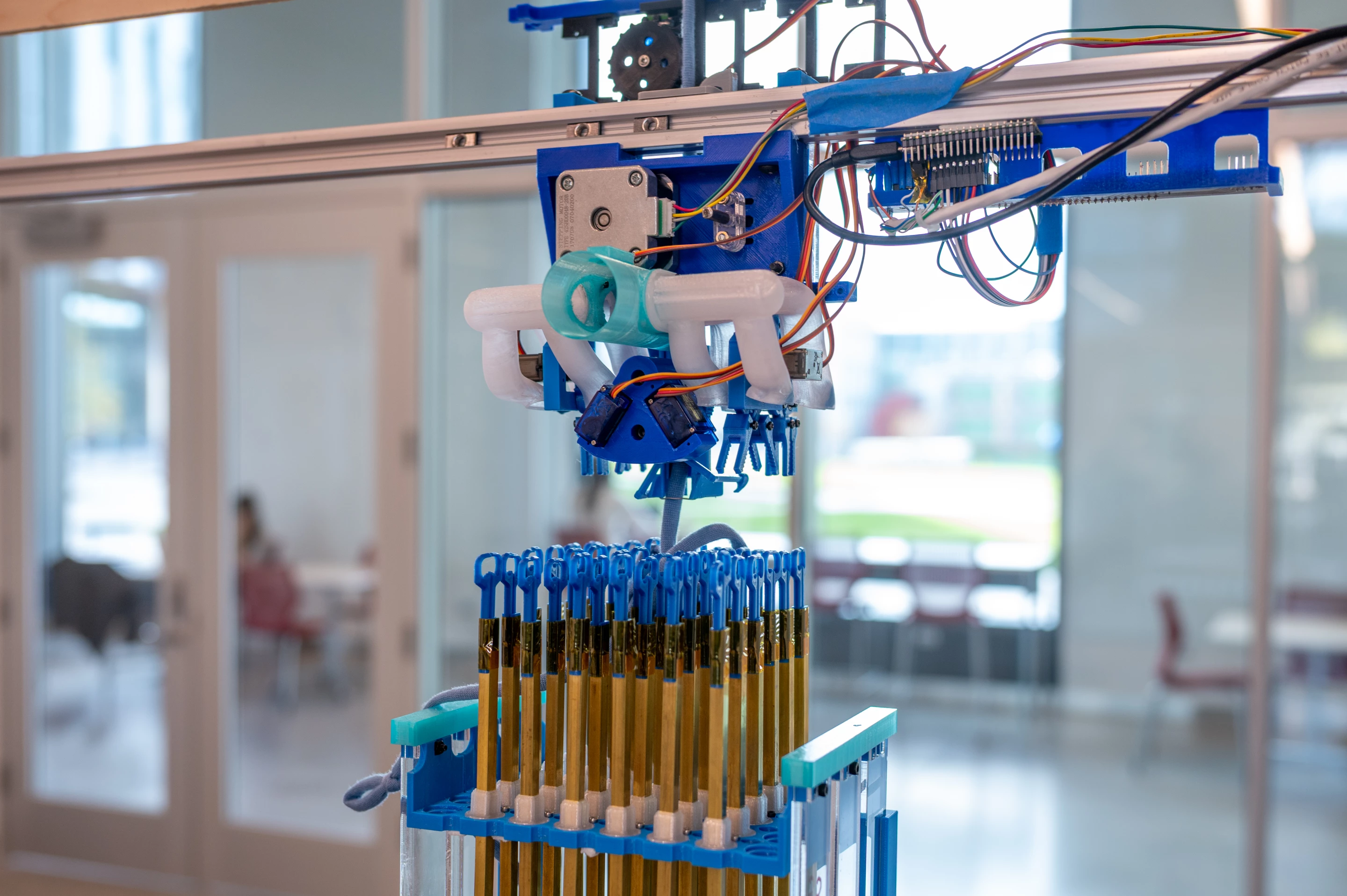 At the heart of the machine is a 6 x 6 block of double-hooked knitting needles