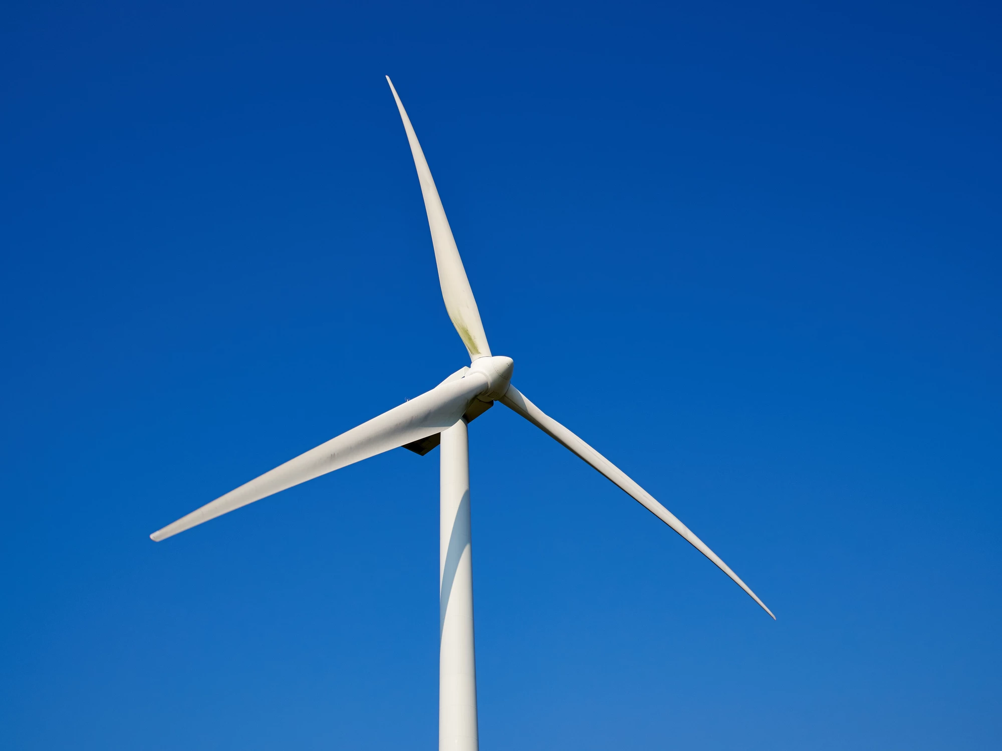 Wind turbines could benefit from placement behind hills, according to a new study