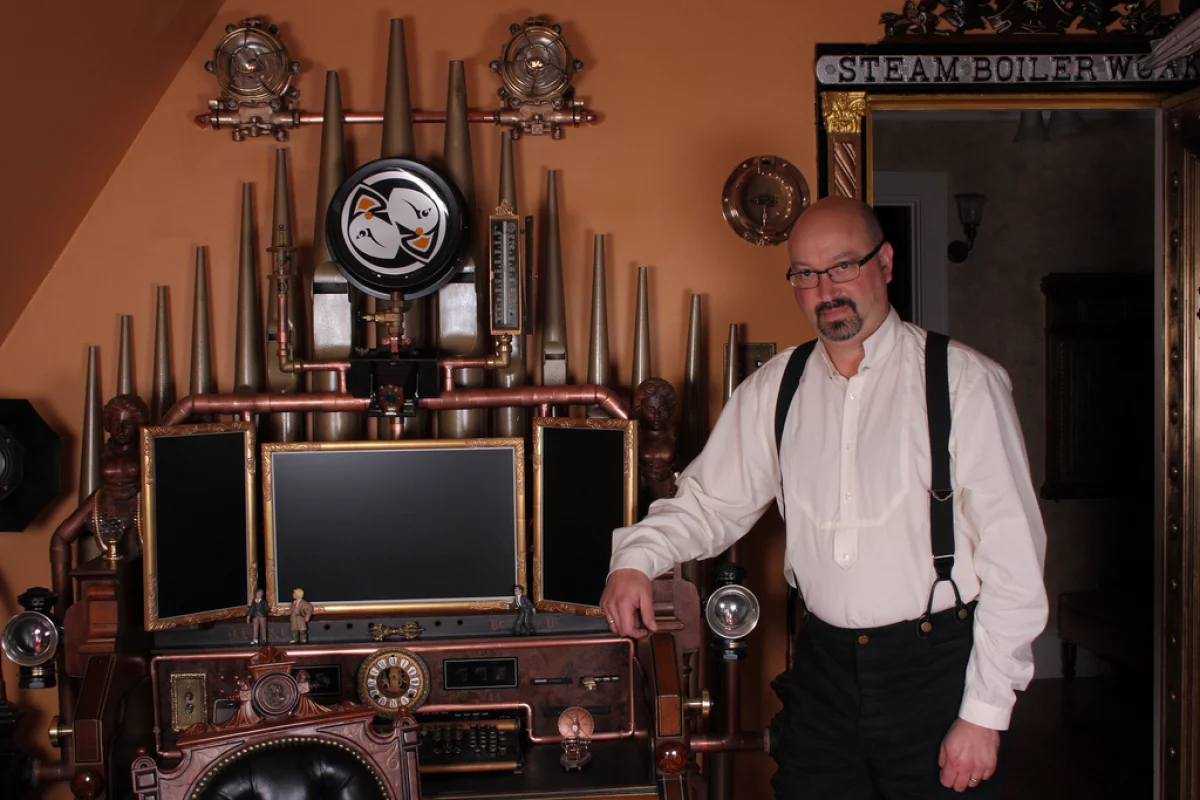 Bruce Rosenbaum alongside his latest creation, the Victorian Organ Command Desk