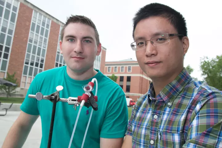 The Ohio State University researchers with the prototype device they call the first aqueous solar flow battery