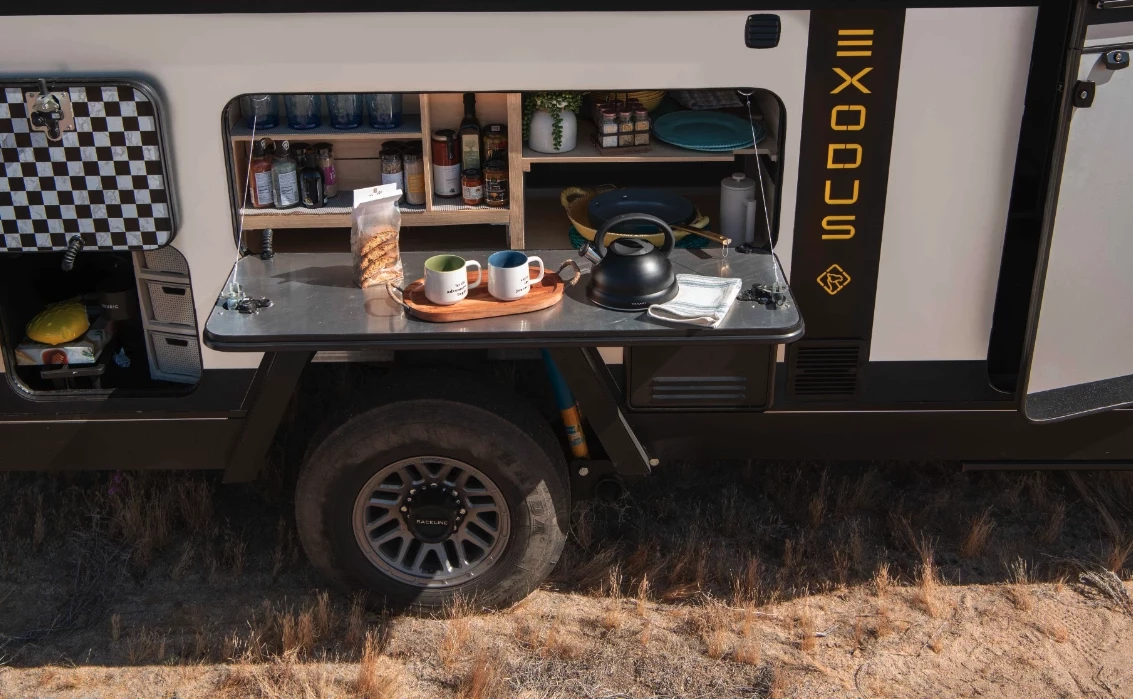 This drop-down hatch provides access to the pantry and doubles as a worktop or table