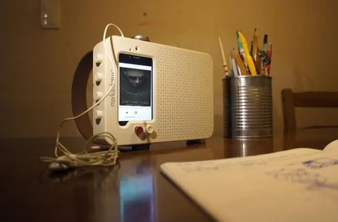 Both the iPhone 5 and 5S can be slotted into the speaker's mount and will fit tightly, while a simple tab folds out to hold the shorter iPhone 4 or 4S in place