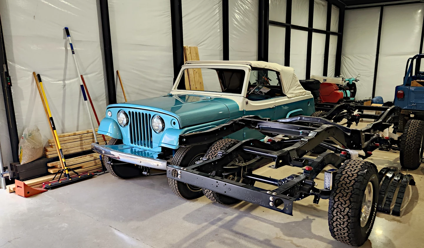 The clean portion of the Vigilante and JeepHeritage shop begins with some of Daniel's personal projects like this Jeepster, alongside frames meant for classic Jeep restorations