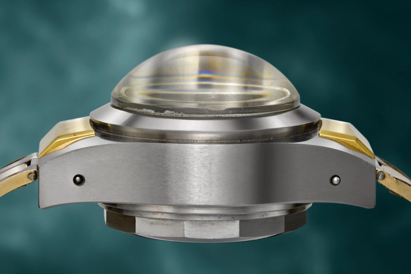 The muscular side profile of the 1953 Rolex Deep Sea Special №1 gives a hint of why it was able to submerge 10,915 metres (35,810 ft) and continue to work flawlessly. At that depth, it experienced a pressure of 1,150 atm or 1,150 kgs per cm2.