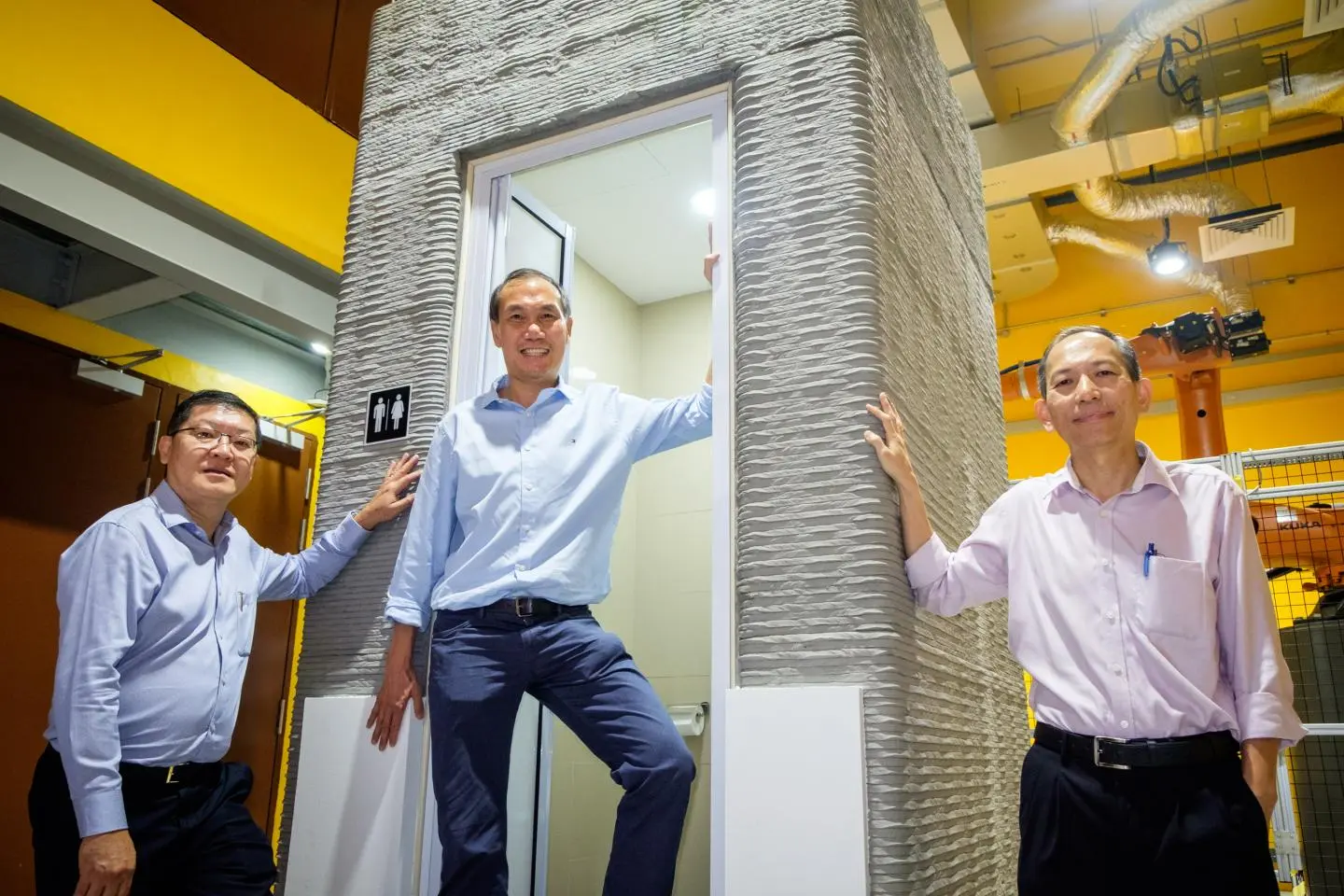 (From right) NTU Associate Professor Wong Teck Neng; Lead Scientist and Associate Professor Tan Ming Jen and Er Lie Liong Tjen with their 3D-printed bathroom unit