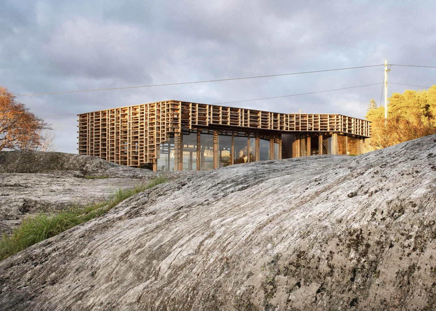 House on an Island is covered in a timber lattice that is designed to make the light inside dapple pleasantly