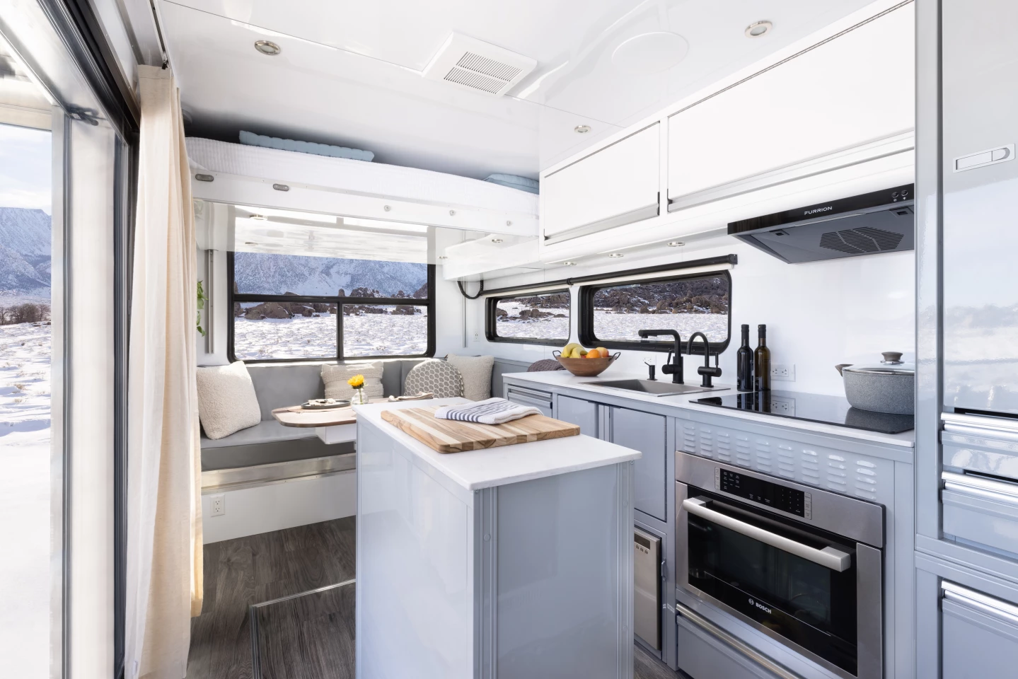 The kitchen includes a movable island for versatility