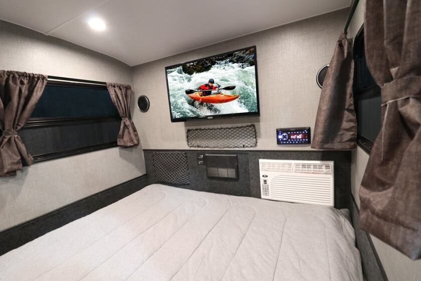 The Luna Rover will share its basic interior layout with the Luna Lite pictured; however, it will have window shades in place of curtains