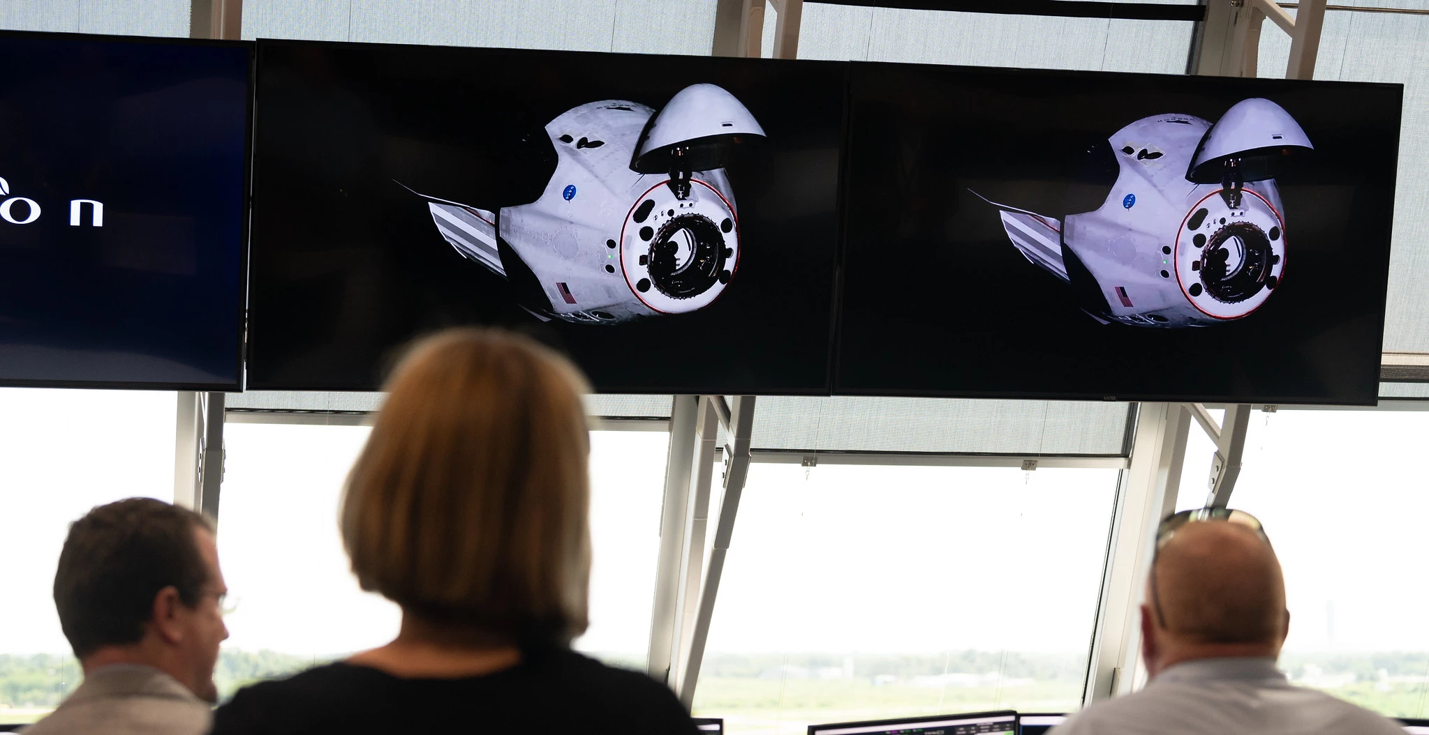 Mission control watches on as the Crew Dragon prepares to dock with the ISS