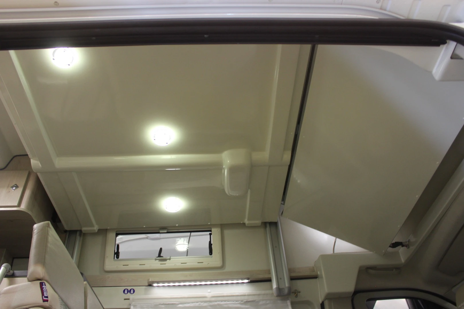 The Karmann Dexter 550 features a forward sleeping layout similar to the 555, with a drop-down bed over top a convertible dinette bed, for a total of four sleeping berths