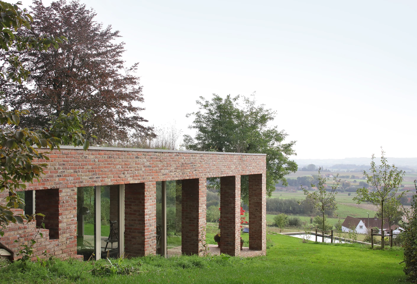 A contemporary family home that boasts a green roof and unrestricted views across the vast landscape