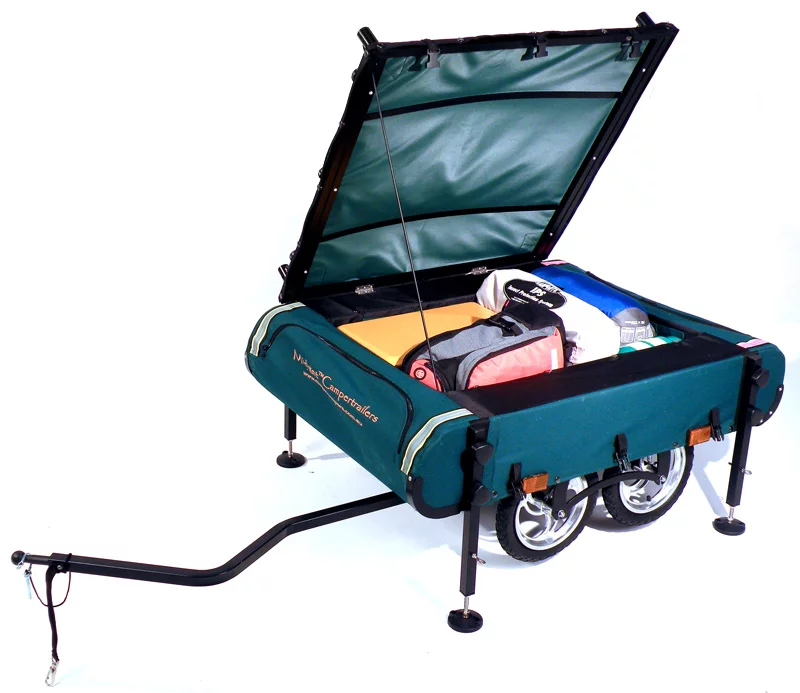 And as large as it is - 56 pounds (25.4 kg) in weight packing in 180 liters (48 US gallons) of storage - Kamp-Rite does not intend that the Bushtrekka be confined to sedate cycle paths