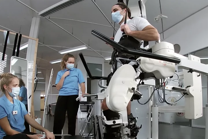 Spinal stimulation synced with rehabilitation robotics allows paralysed people to move