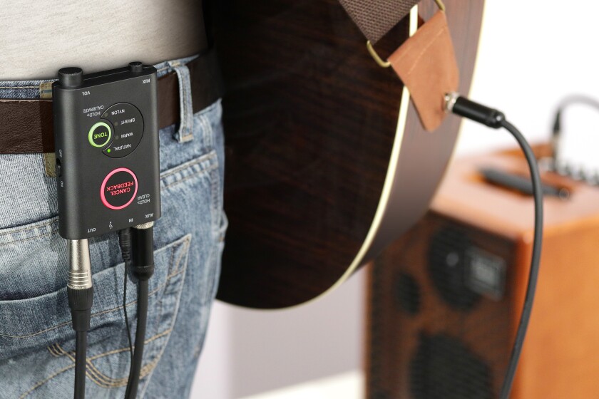 The iRig Acoustic Stage preamp and DSP box can be attached to a player's belt