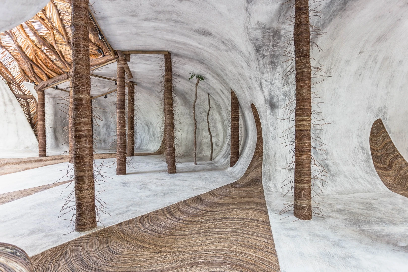 Designed to connect its visitors with nature, guests are invited to wander barefoot across the IK Lab's winding, polished cement floors