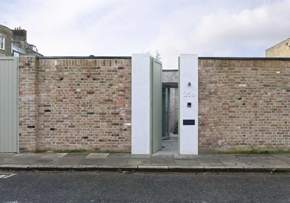 Ordinary looking garden wall conceals two-bedroom courtyard home