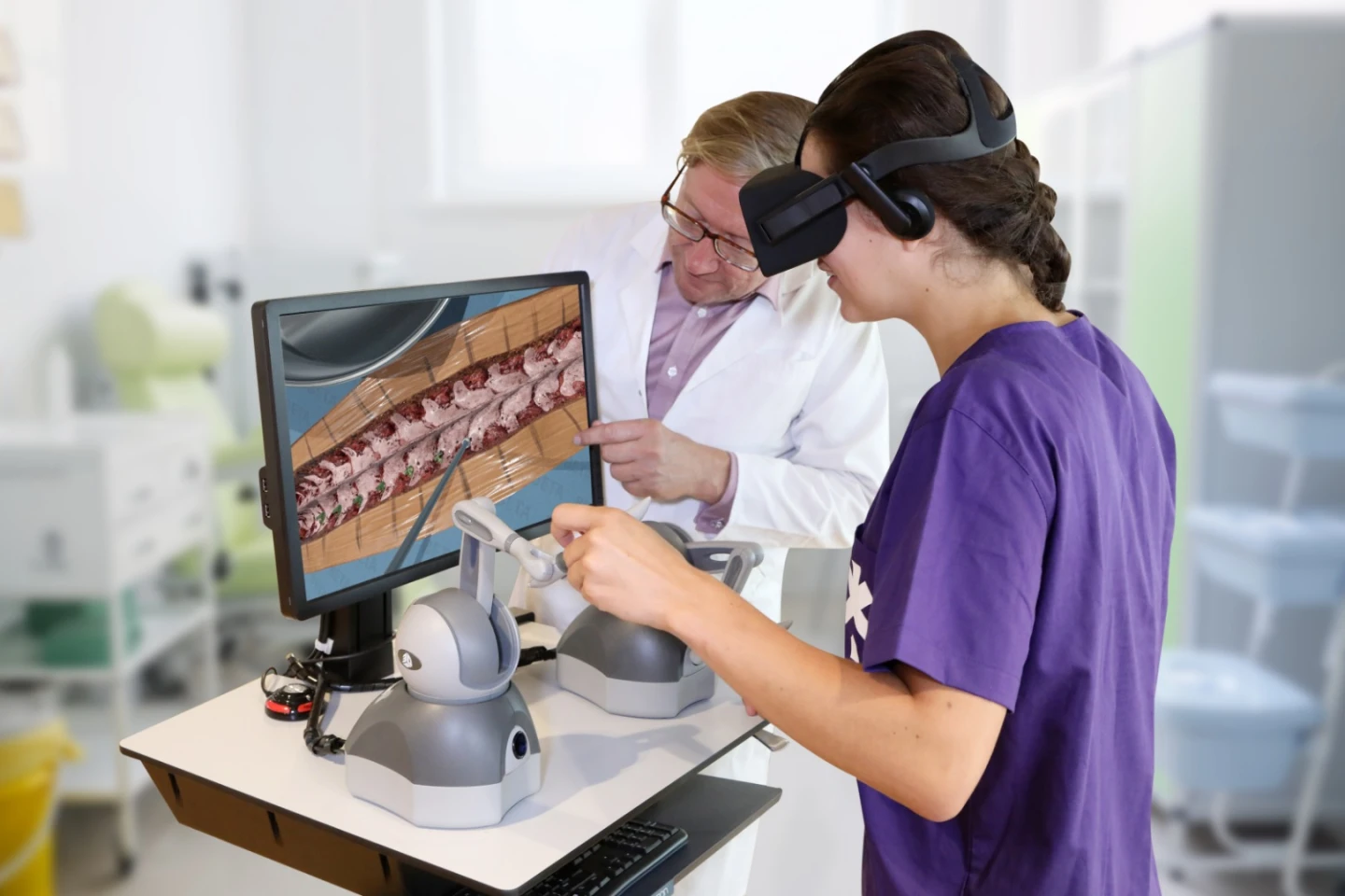 A student uses the Fundamental Surgery system to perform a virtual spinal operation