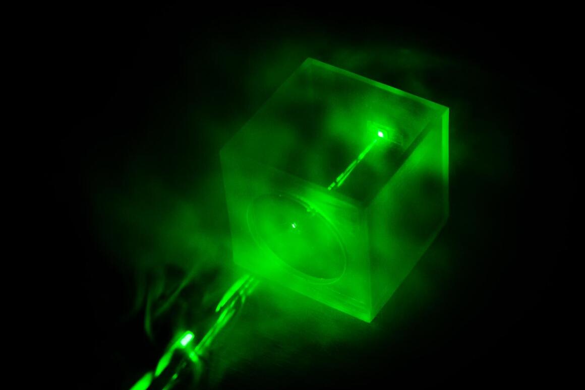 A Raman laser shines on a special chip, which traps gas molecules