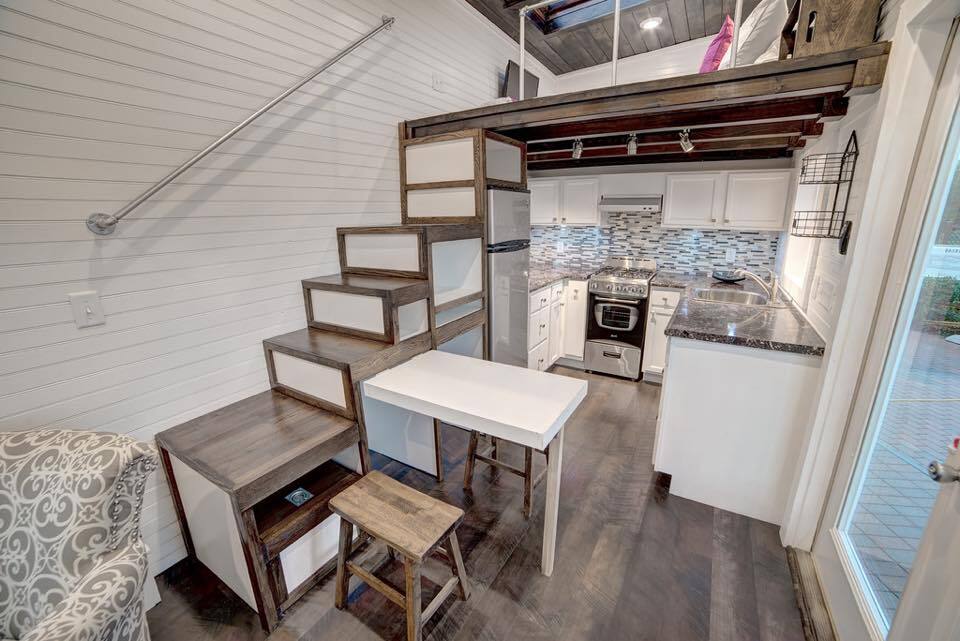 A pop-up table serves as a kitchen and dining table
