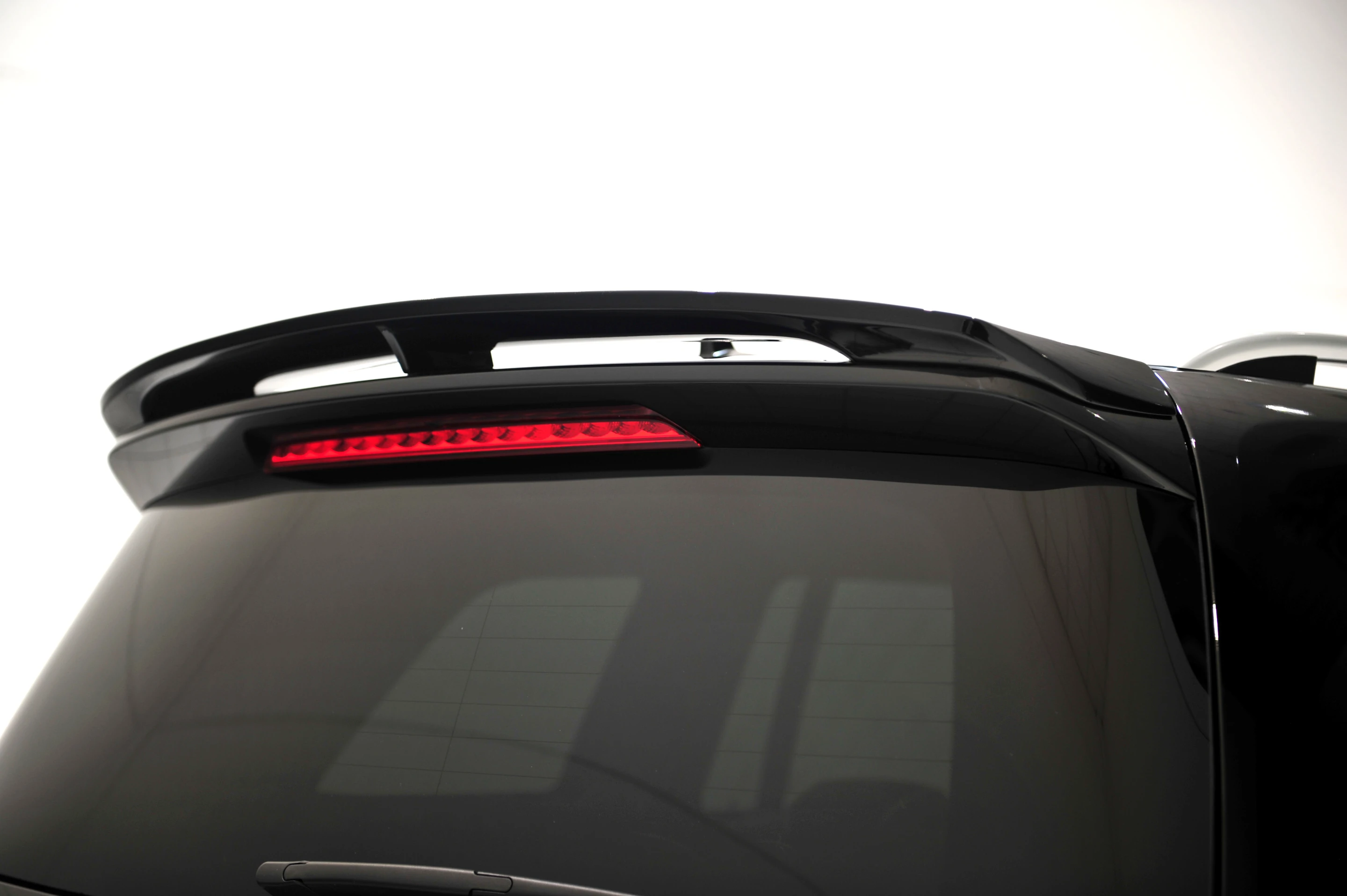 More aggressive rear spoiler enhances downforce and rear end stability at speed