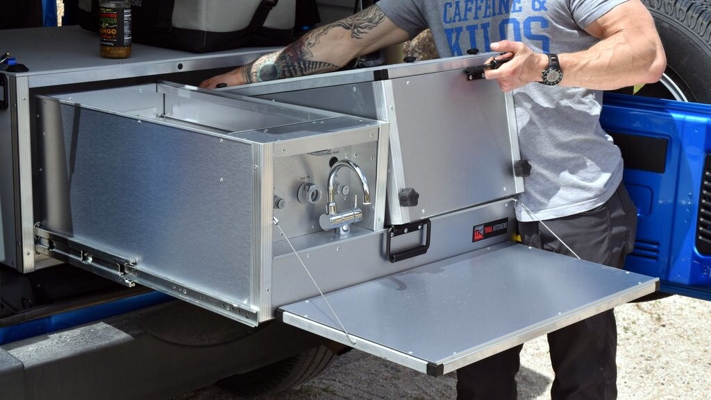 The Camp Kitchen removes from the Wrangler Camping System, setting up outside and leaving added space in the vehicle for temporary storage