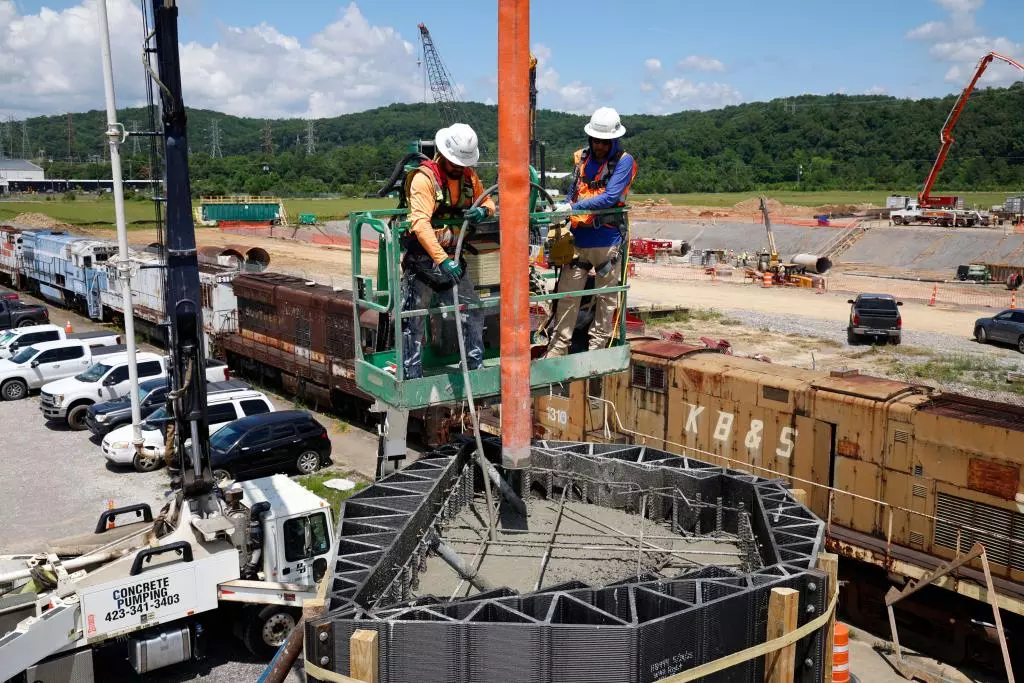 Pouring concrete into the 3D-printed forms