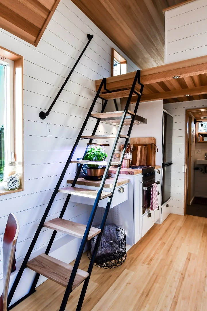 The Urban Payette with Elevator Bed has a roomy main sleeping loft, accessed by these steps