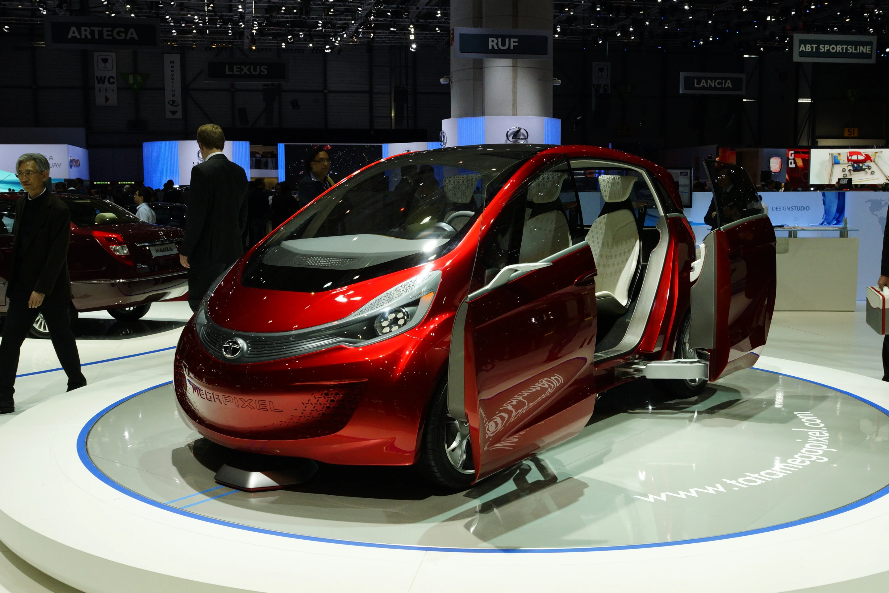 The Tata Megapixel has acutely turning wheels which give it a turning radius of just 2.8 meters, an inductive home charging system and some very useful automatic sliding double doors.