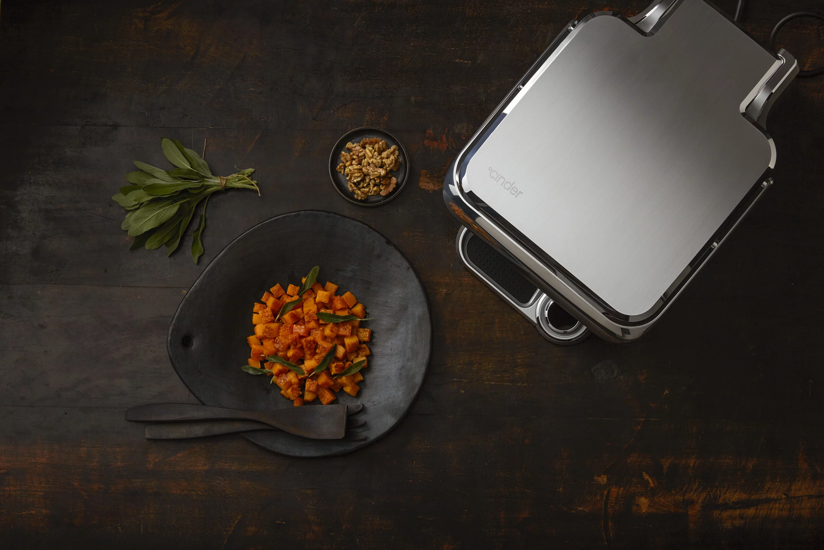 The Cinder Sensing Cooker brings precision temperature control to home grilling