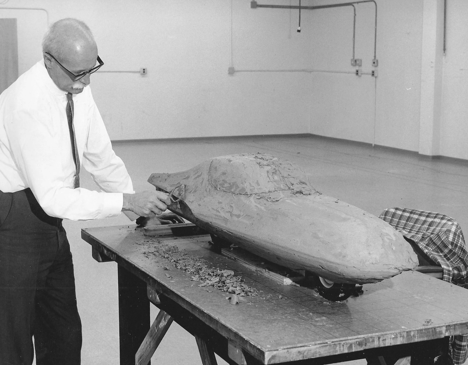 Designer Alex Tremulis working on a clay model of the Gyro-X