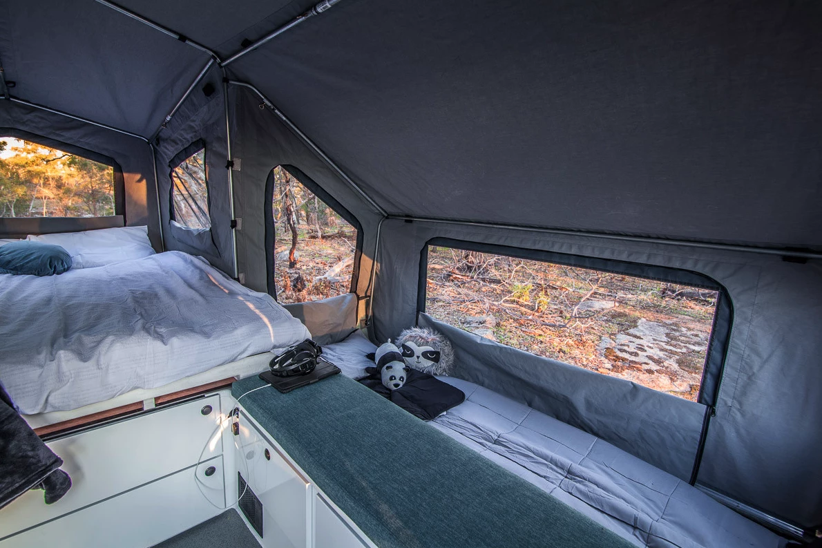 Kerfton places the beds on the outside of the benches so that there's none of the usual bench-to-bed conversion