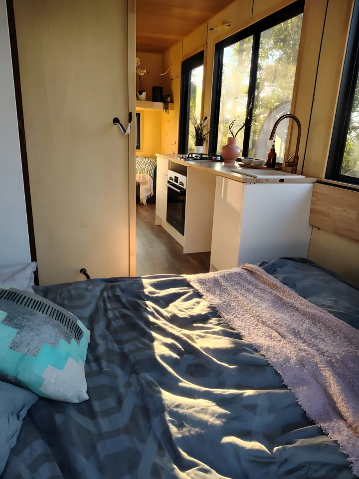 The Escapada's multipurpose bedroom, shown with the Murphy style bed pulled down from the wall