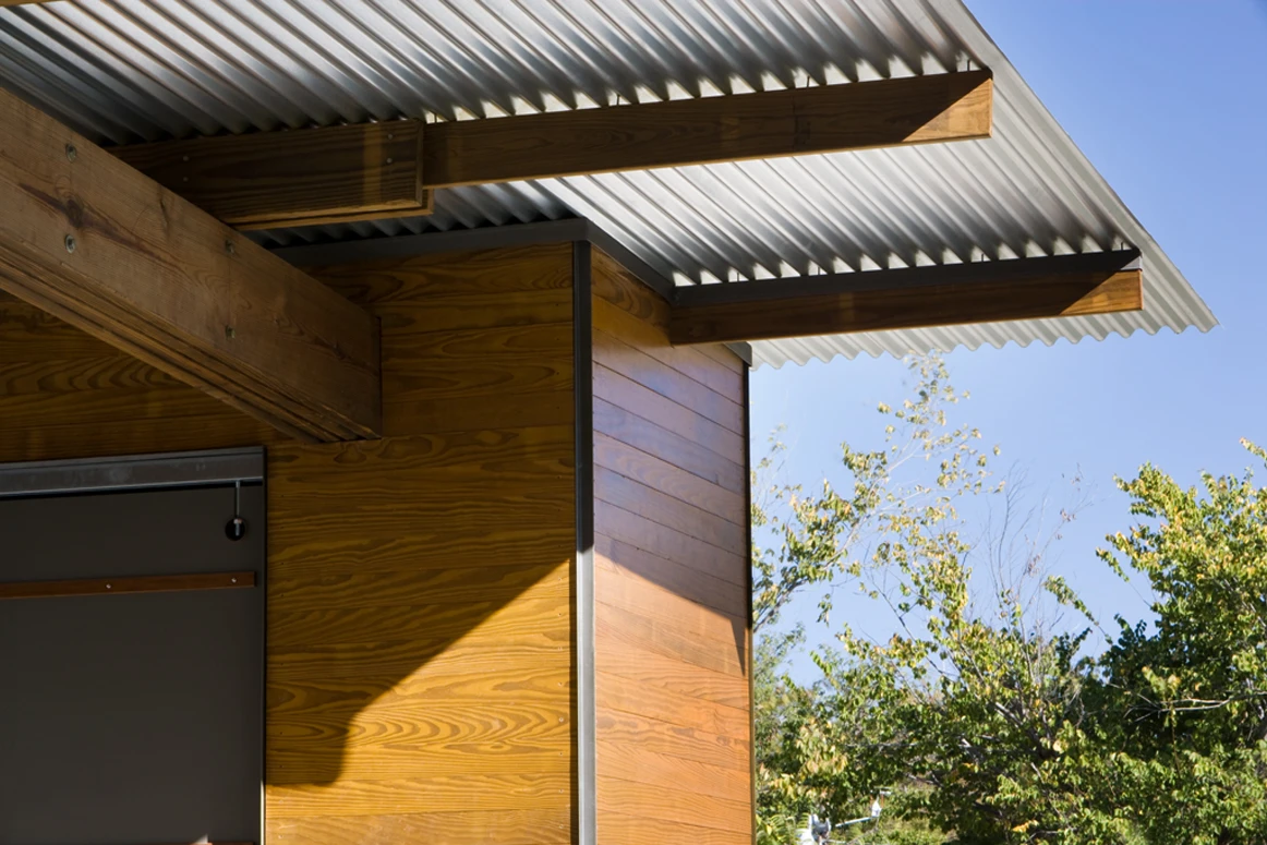 The door frame features wooden planks salvaged from the same dance floor once used by the clients at their wedding party (Photo: Charles Davis Smith)