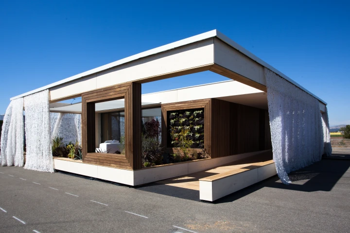 The winning house, LISI, by the Vienna University of Technology features a lace-like UV curtain and large patio living spaces (Photo: Jason Flakes (Nomoi)/U.S. Department of Energy)