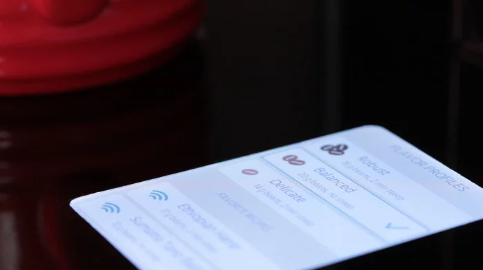 A touchscreen interface on the Bruvelo offers quick access to coffee profiles and recipes