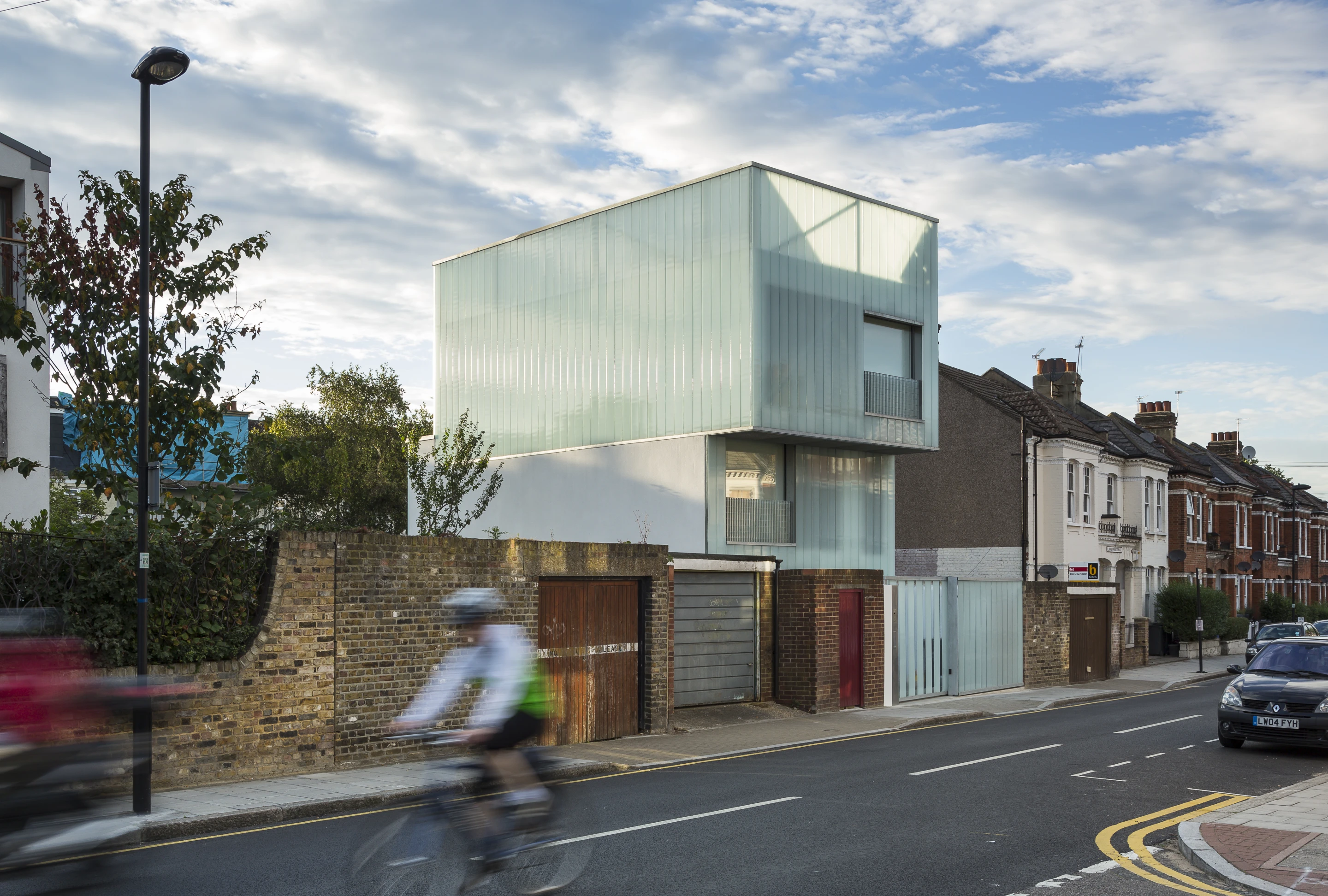 Slip House combines sustainable technologies with an unusual design based on three "slipped" orthogonal boxes
