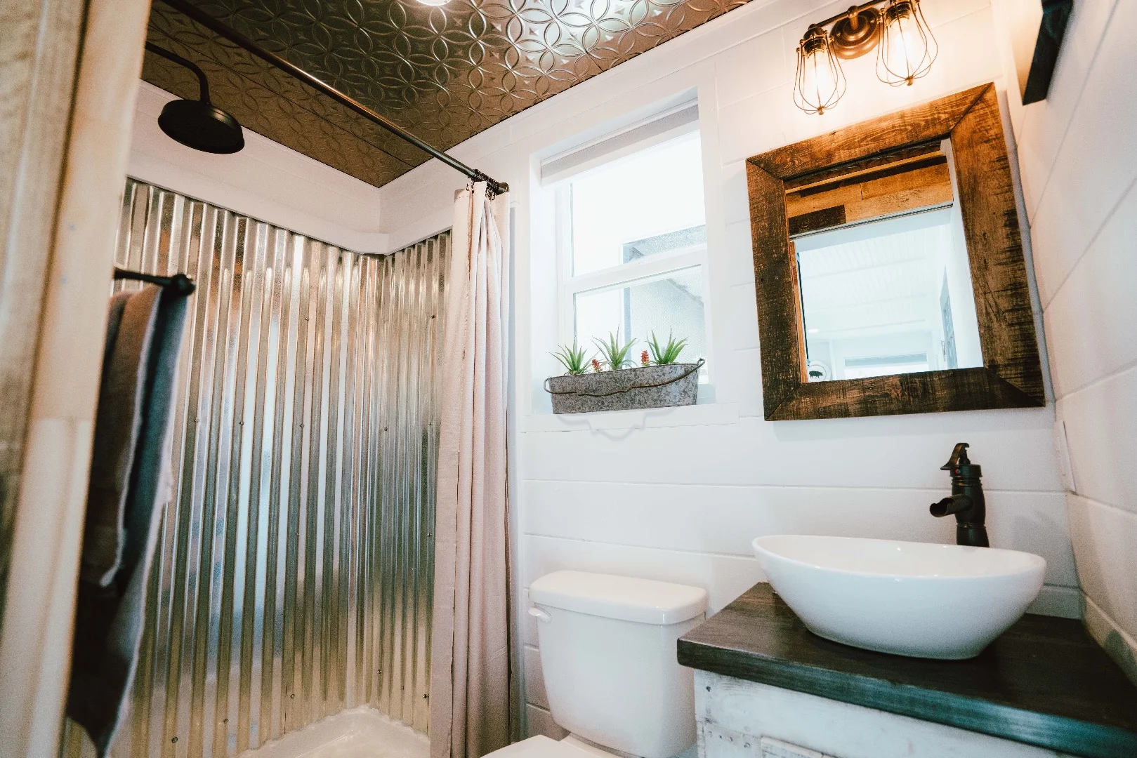The City's bathroom includes galvanized steel-lined shower