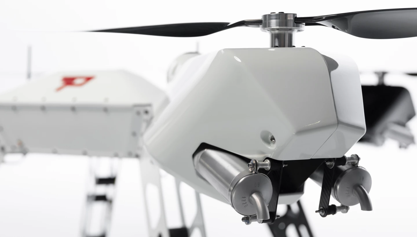 While a fuel tank feeds the gas engines, the Firefly drone's electric motors are powered by a 60V/5,000-mAh lithium battery