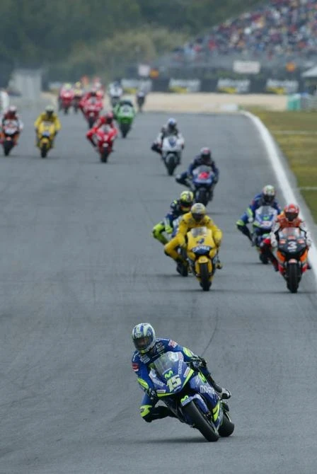 The first lap is completed and Sete has already checked out from the bunch. That's Carlos Checa and Maxs Biaggi leading the charge from Valentino Rossi and Marco Melandri, Colin Edwards, John Hopkins, Carlos Checa, Troy Bayliss and Nicky Hayden