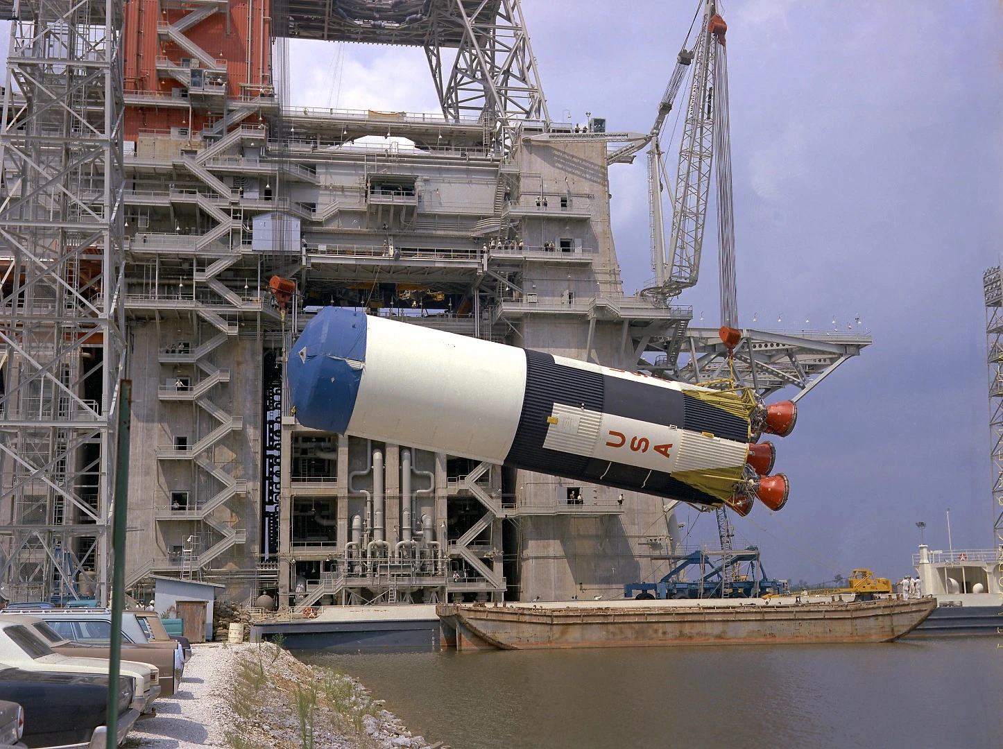 The Saturn V S-IC-5 (first) flight stage being hoisted into the S-IC-B1 test stand at the Mississippi Test Facility (MTF), Bay St. Louis, Mississippi