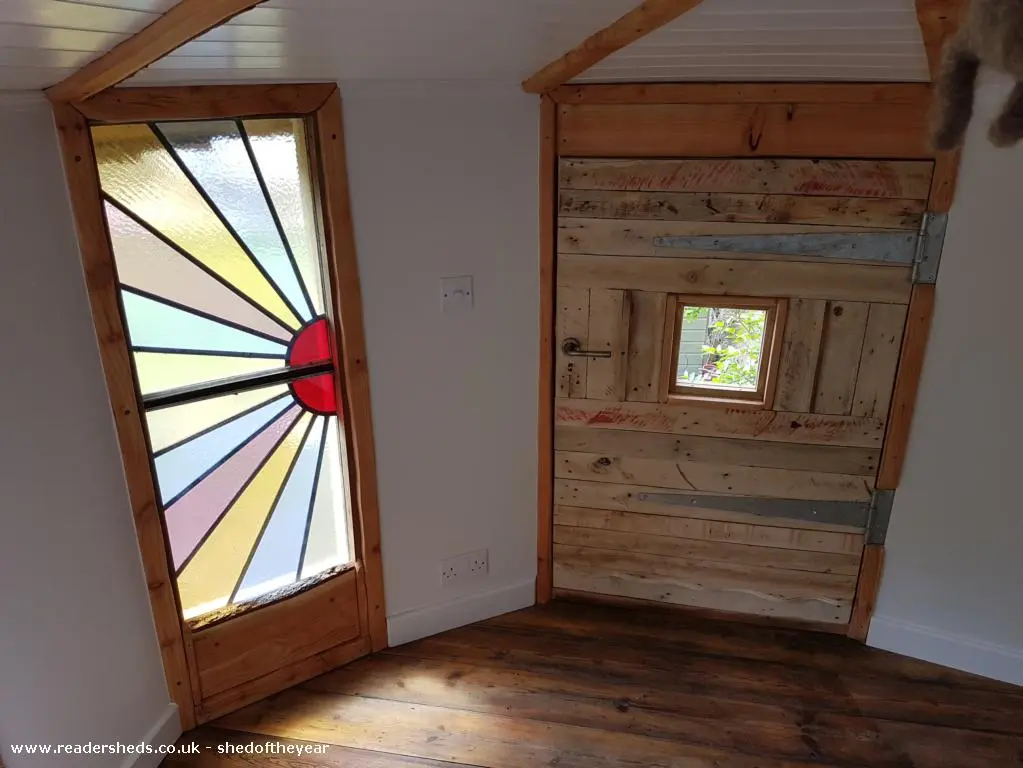 The Mushroom House features stained glass windows