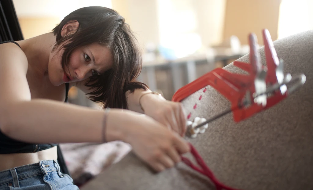 HUSH is sewn by hand with 150 meters (490 feet) of wool yarn
