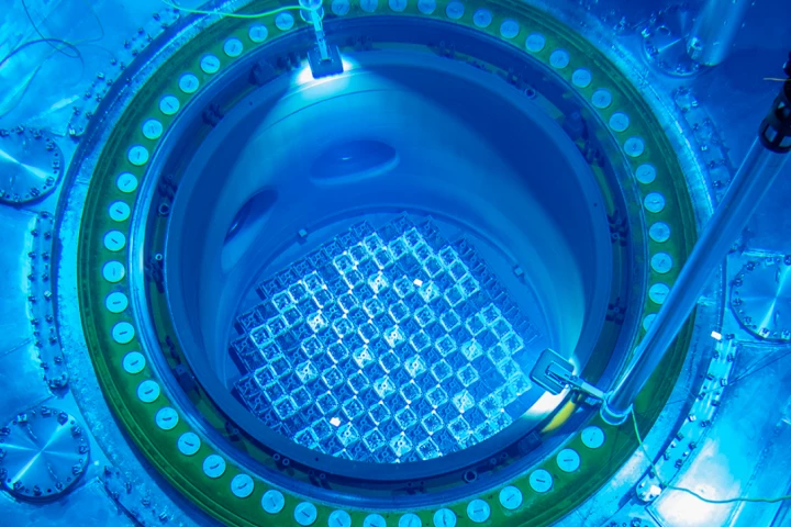 The new enriched rods being installed in the reactor