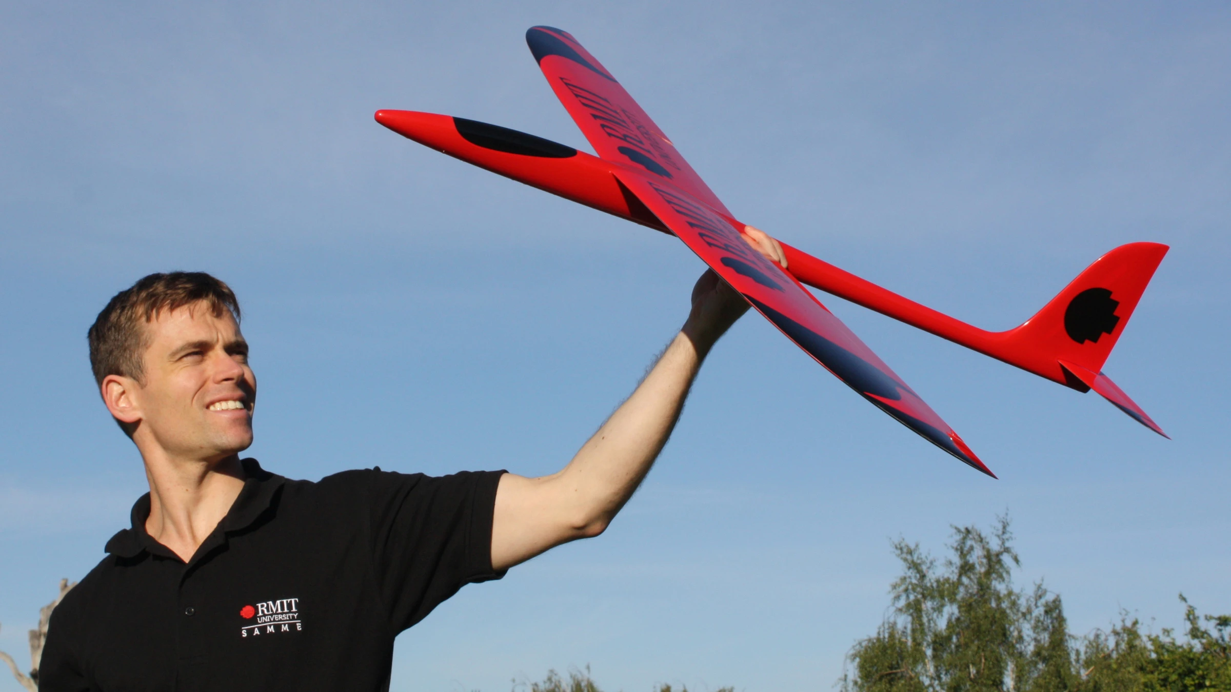 Dr Reece Clothier with a prototype of a bio-inspired unmanned aircraft, under development at RMIT
