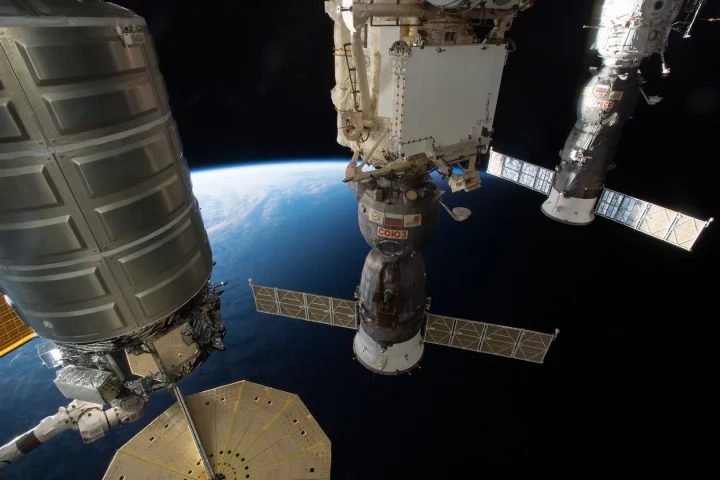 Spacecraft docked at the International Space Station, the largest human-built structure in space