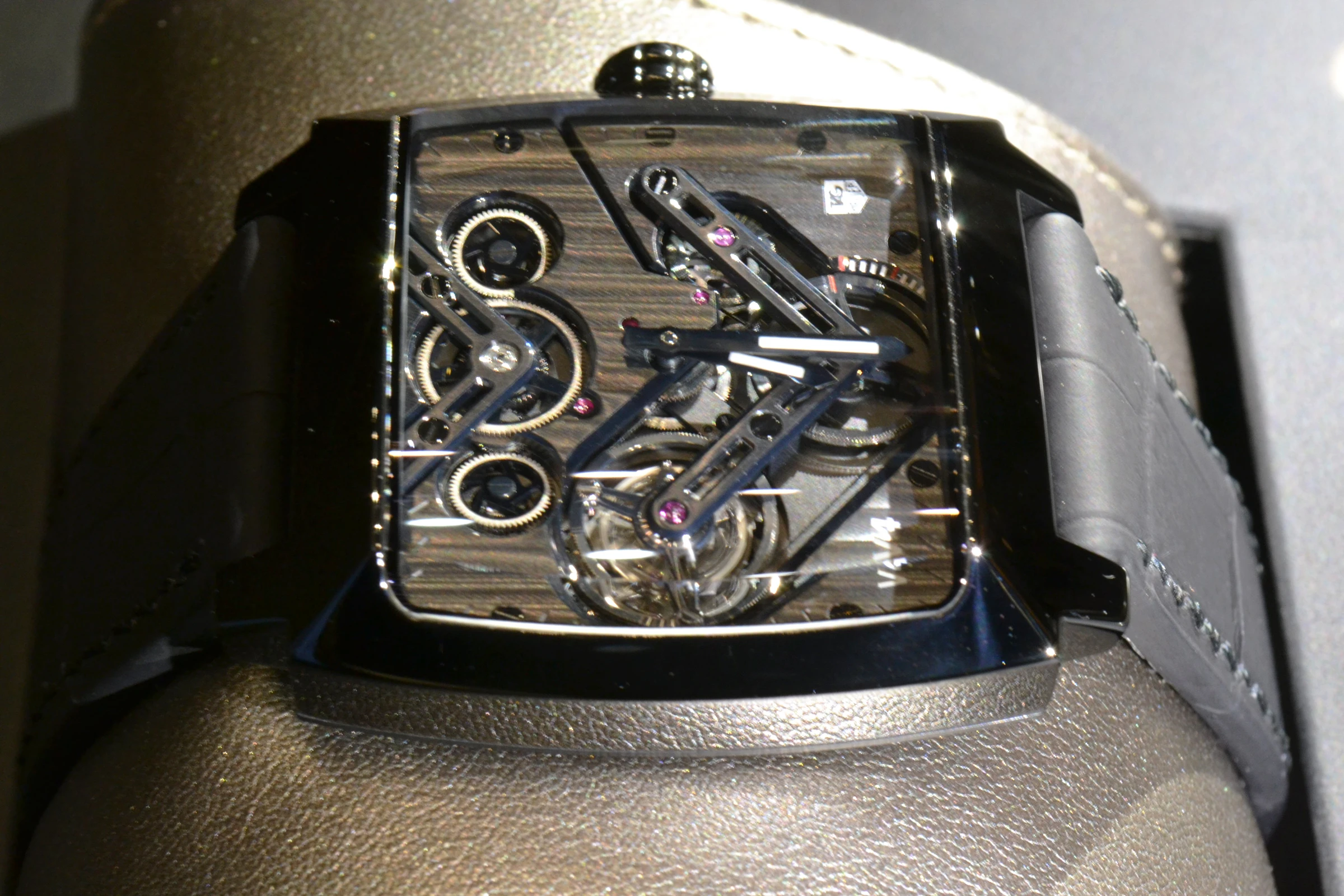 Stand-out features include a black titanium and sapphire case, an automatic linear rewinding system, a mass that's guided by a linear railroad as opposed to the traditional rotating system, and barrels that are held and rotated on ball bearings