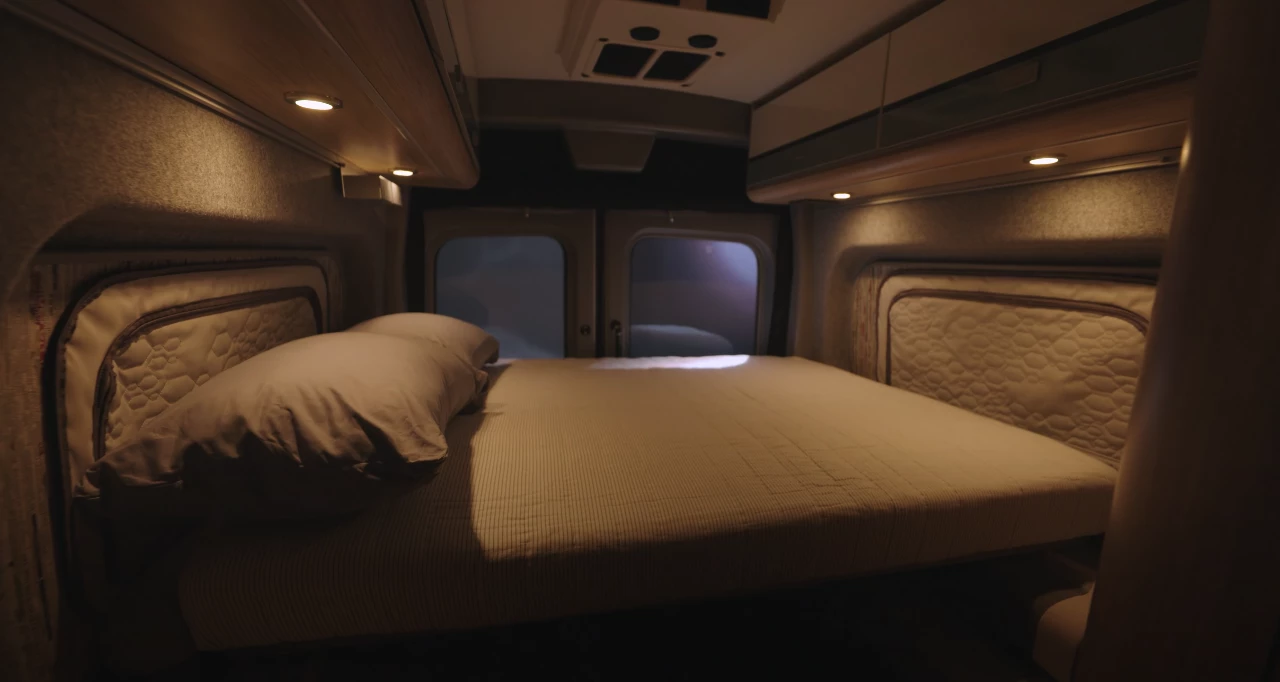 The Winnebago eRV2's rear lounge converts into a transverse bed