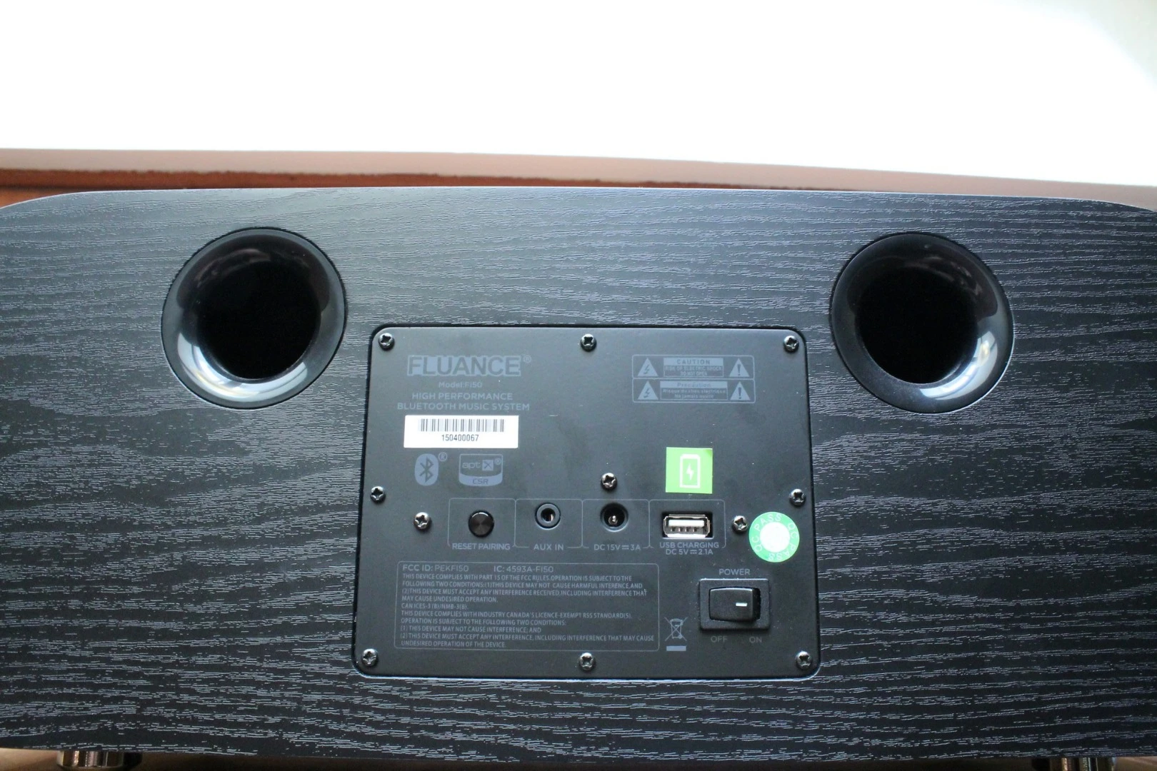 The rear panel has a 3.5-mm input and USB charging station