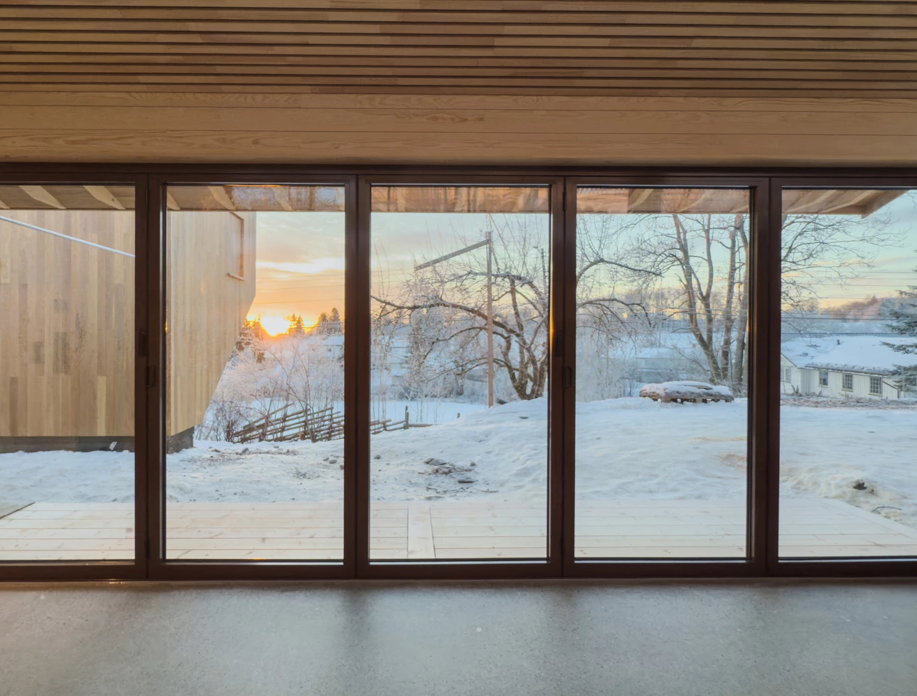Glass panels open fully to connect kitchen and garden seamlessly